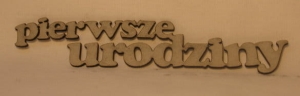 Napis PIERWSZE URODZINY 12x2,7 cm